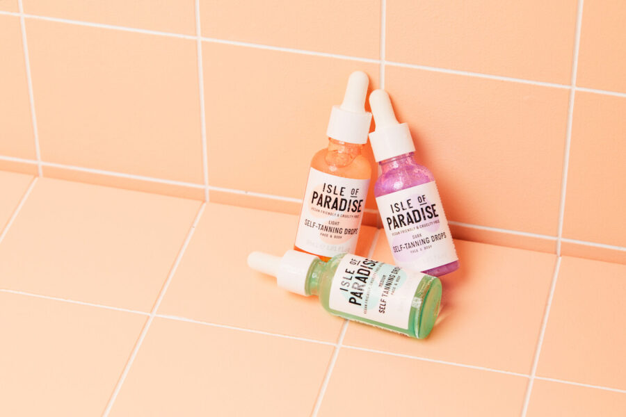 Isle of Paradise Self Tanning Drops Light, Medium and Dark against bathroom tile