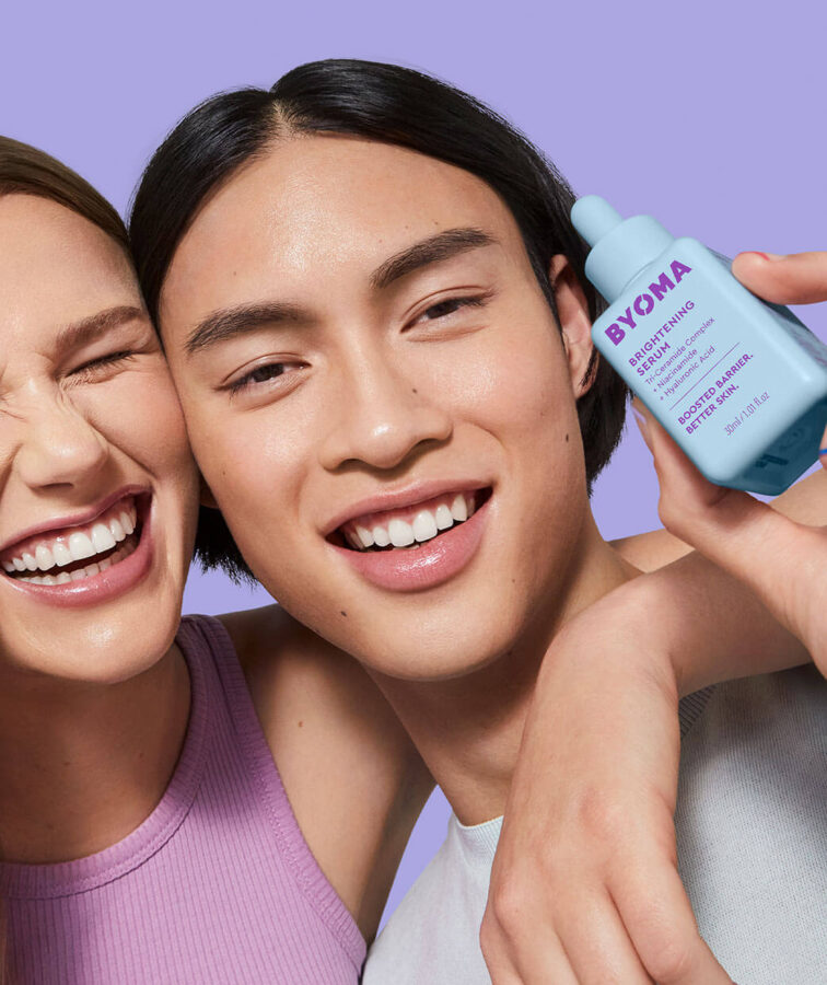byoma skin care person holding up brightening serum
