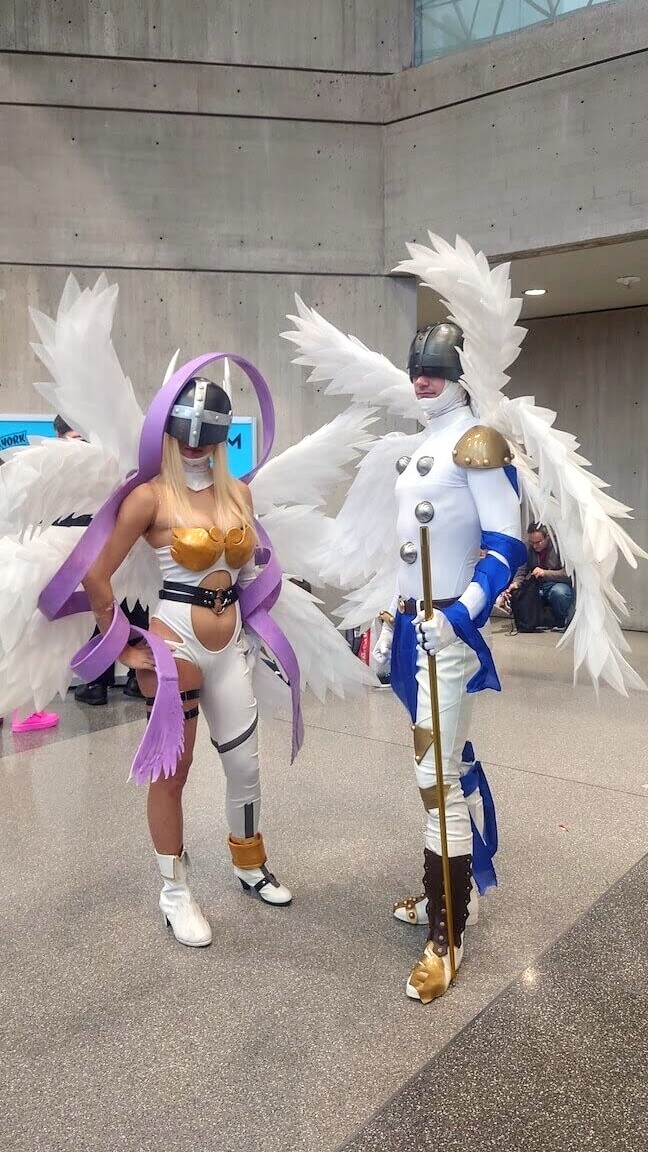 NEW YORK, NEW YORK - OCTOBER 14: Angewoman and Angemon Digimon cosplays at NYCC at Javits Center on October 12, 2023 in New York City. (Photo by Sophia Calderone)