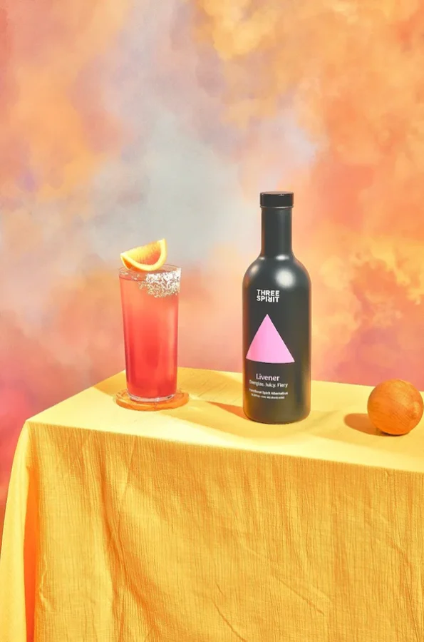 Three Spirit Livener Mocktail and bottle