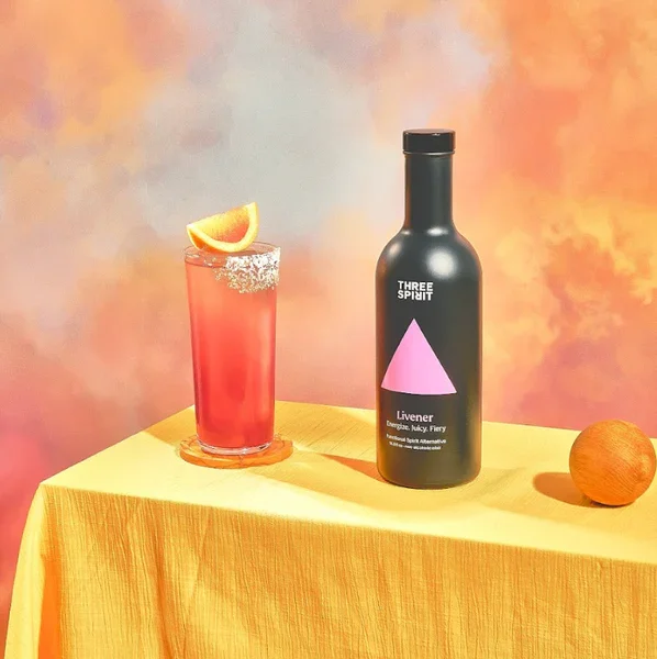 Three Spirit Livener Mocktail and bottle
