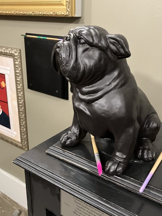 Dog statue and paint brush.