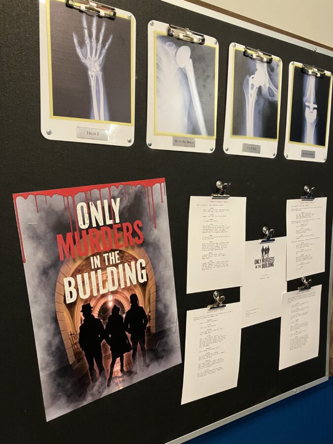 X-Rays and Only Murders in the Building poster on bulletin board.