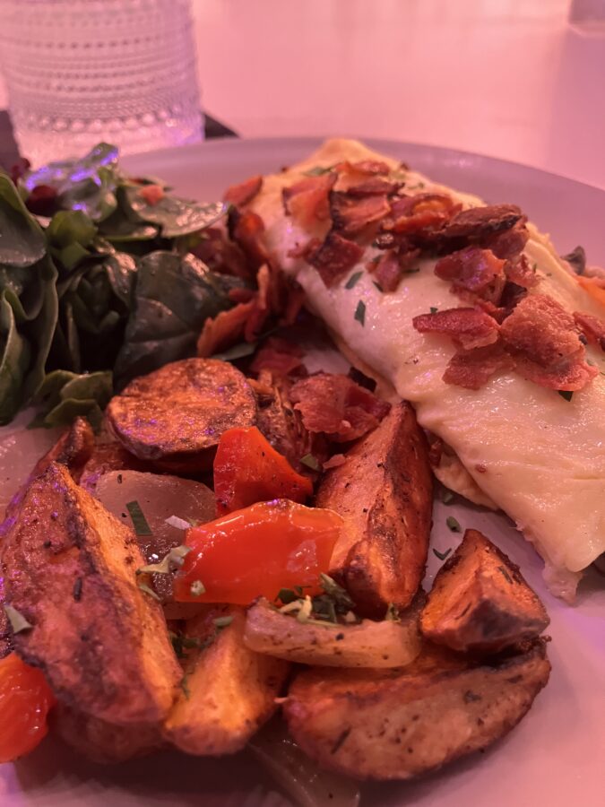 Omelet with potato wedges and salad