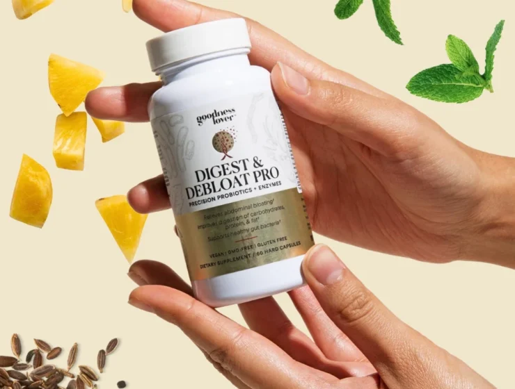 Image of hands holding Goodness Lover Digest & Debloat Pro dietary supplement