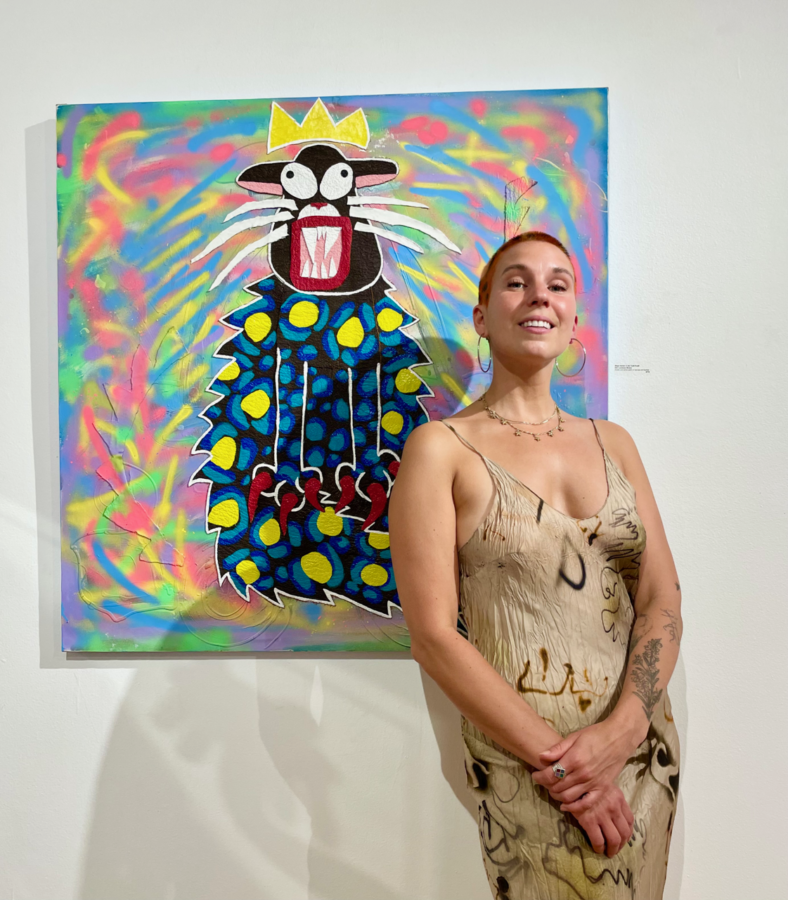 Elin Lundman in front of one of her paintings