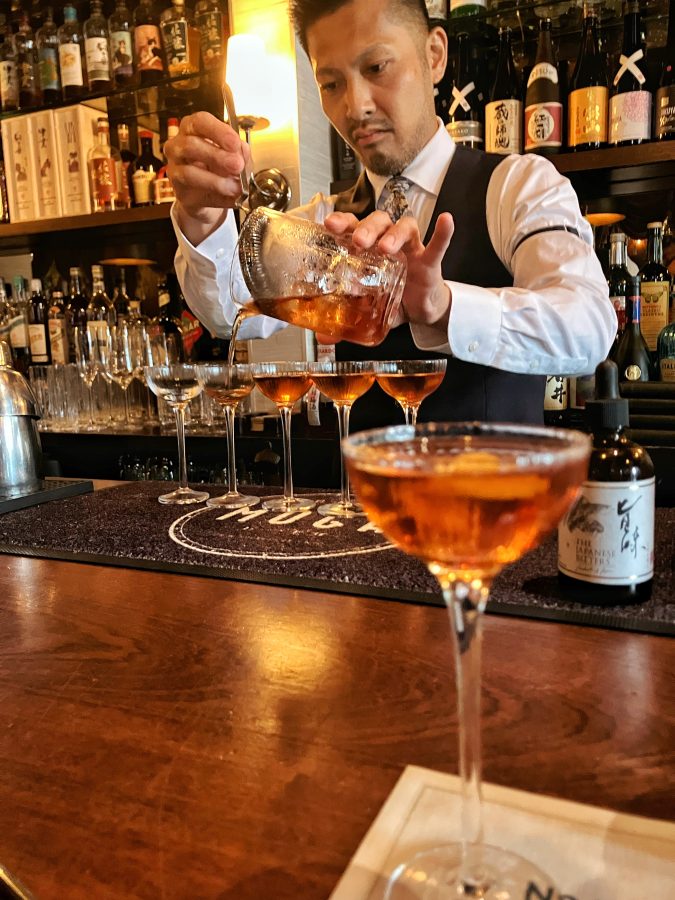 Hirotomo Akutsu making martinis